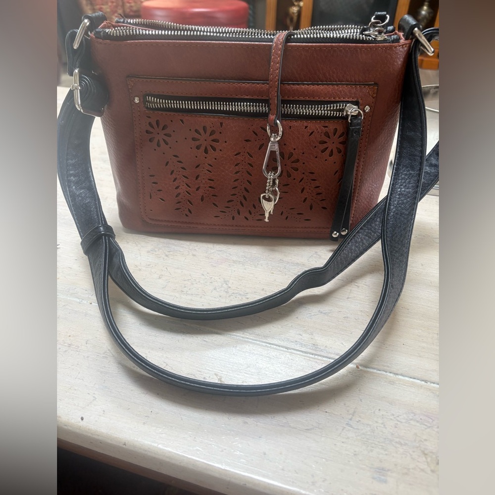 Conceal and carry faux leather w/ laser cut accents and contrast trim
